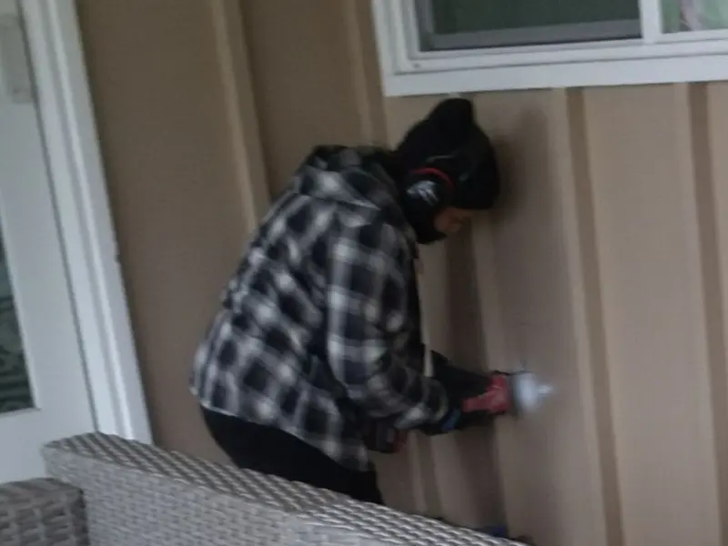 Professional electrician installing an exterior outlet in Manheim