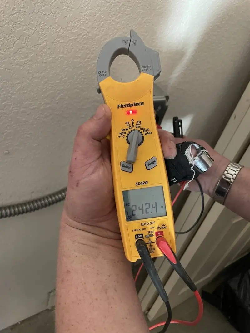 Voltage testing with clamp meter during Ceiling Fan Installation in Manheim